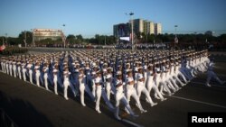 Soldiers march to mark the Armed Forces Day and commemorate the landing of the yacht Granma, which brought the Castro brothers, Ernesto "Che" Guevara and others from Mexico to Cuba to start the revolution in 1959, in Havana, Cuba, Jan. 2, 2017.