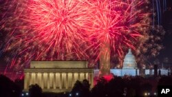 FILE - Fireworks burst on the National Mall above the Lincoln Memorial, Washington Monument and the U.S. Capitol building during Independence Day celebrations in Washington, Monday, July 4, 2022.