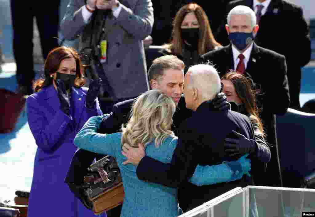 U.S. President Joe Biden embraces his family during his inauguration as the 46th President of the United States on the West Front of the U.S. Capitol in Washington.
