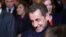 FILE - Former French President Nicolas Sarkozy leaves his headquarters in Paris, Nov. 29, 2014.