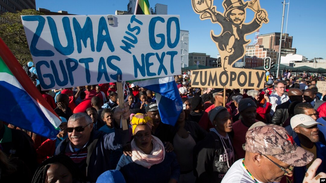 Protesters call for the removal of president Jacob Zuma in a march on Parliament in Cape Town, South Africa, Monday, Aug. 7, 2017. South Africa's parliament will vote by secret ballot on a motion of no confidence on South African President Jacob Zuma on 