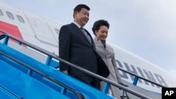 Presiden China Xi Jinping dan isteri tiba di Belanda untuk melakukan lawatan kenegaraan (22/3). 