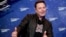 FILE - In this Tuesday, Dec. 1, 2020 file photo, SpaceX owner and Tesla CEO Elon Musk arrives on the red carpet for the Axel Springer media award, in Berlin, Germany. 