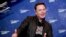 FILE - In this Tuesday, Dec. 1, 2020 file photo, SpaceX owner and Tesla CEO Elon Musk arrives on the red carpet for the Axel Springer media award, in Berlin, Germany. Technology mogul Elon Musk has a lined up a new gig in addition to his jobs as CEO…