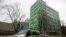 FILE - A car of Russian state-owned television station RT passes by the company's office in Moscow, Russia, Oct. 27, 2017. 