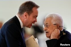 FILE—President of the World Economic Forum Borge Brende speaks with Palestinian President Mahmoud Abbas during the World Economic Forum (WEF) in Riyadh, Saudi Arabia, April 28, 2024.