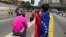 Les Vénézuéliens manifestant dans les rues de Caracas, le 1er mai 2019.