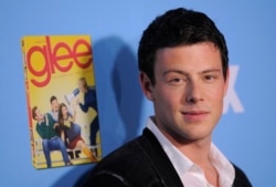 FILE - Cory Monteith, a cast member in "Glee," poses at the television show's second season premiere in Los Angeles, Sept. 7, 2010.