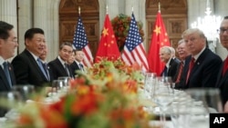 FILE - President Donald Trump and China's President Xi Jinping lead their respective delegatiosn during their bilateral meeting at the G-20 Summit, Dec. 1, 2018, in Buenos Aires, Argentina.