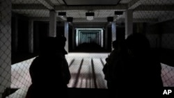 Visitors view a multimedia exhibition that marks the 100th anniversary of the creation of Czechoslovakia, in Prague, Czech Republic, Oct. 3, 2018.