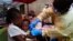 FILE - A child is vaccinated against Ebola in Beni, Democratic Republic of the Congo, July 13, 2019.