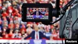 Republican presidential nominee and former U.S. President Donald Trump is seen in a camera viewfinder as he speaks during a campaign event at Dorton Arena in Raleigh, North Carolina, Nov. 4, 2024.