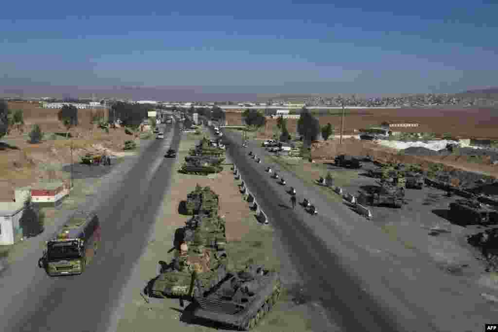 This aerial view shows abandoned tanks on a highway in Mankat al Hatab, near Daraa, Syria.