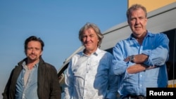 A picture taken on June 10, 2016 shows, from left, Richard Hammond, James May and Jeremy Clarkson posing at the Ticketpro Dome in Johannesburg, South Africa.