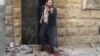 A man reacts as he stands on bloodstains at a site hit by airstrikes in the rebel-held area of Aleppo's al-Fardous district, Syria, April 29, 2016. 