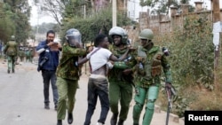 Riot police detain a supporter of Kenya's opposition leader Raila Odinga, as he participates in an anti-government protest against the imposition of tax hikes by the government in Nairobi, Kenya July 19, 2023. 