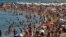 People sunbathe on a beach in Barcelona, Spain, Aug. 1, 2018. 