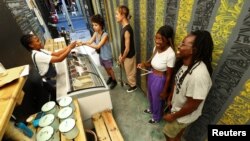 FILE: Customers buy ice cream at the Tapi Tapi ice cream shop in Observatory, in Cape Town, South Africa. Taken December 20, 2022.