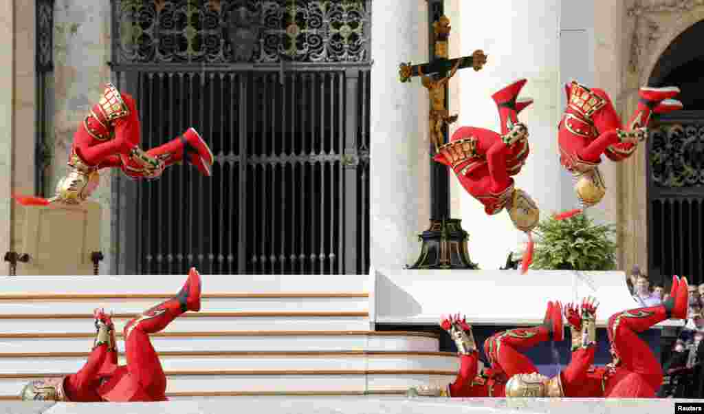 Acrobats perform at the end of Pope Francis general audience in Saint Peter's square at the Vatican.