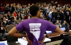 FILE - A precinct captain argues his position during a Democratic caucus at the University of Nevada in Reno, Nevada, Feb. 20, 2016.