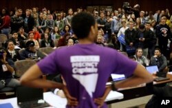 FILE - A precinct captain argues his position during a Democratic caucus at the University of Nevada in Reno, Nevada, Feb. 20, 2016.