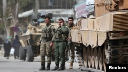 FILE - Turkish soldiers are seen in the center of Afrin, Syria, March 24, 2018.