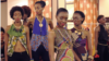 Models wearing East African designer wear prepare for a runway show in Kampala. May 17, 2014. (Hilary Heuler / VOA News)