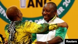 Deputy president of South Africa Cyril Ramaphosa greets an ANC member during the 54th National Conference of the ruling African National Congress (ANC) at the Nasrec Expo Center in Johannesburg, South Africa, Dec. 18, 2017.