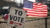 Znak za glasačko mesto na primarnim izborima u Mičigenu (AP/Paul Sancya)
