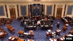 FILE - The U.S. Senate floor at the Capitol building in Washington, D.C.