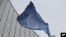 (FILE) The flag of the International Atomic Energy Agency flies in front of its headquarters in Austria.