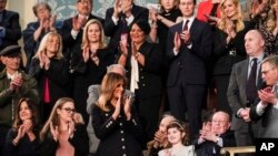 FILE - First Lady Melania Trump and guests in the first lady's box applaud during the 2019 State of the Union address.