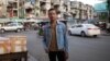 Prumsodun Ok stands in the middle of a street in Phnom Penh, Cambodia, July 19, 2016. (Courtesy of Lim Sokchanlina)
