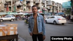 Prumsodun Ok stands in the middle of a street in Phnom Penh, Cambodia, July 19, 2016. (Courtesy of Lim Sokchanlina)