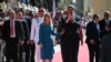 Venezuela's President Nicolas Maduro (C) and First Lady Cilia Flores walk on arrival at the Capitolio for the presidential inauguration, in Caracas on January 10, 2025.