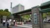 FILE - This photo shows an exterior view of the Defense Ministry of Japan with its sign at the main entrance in Tokyo on Sept. 17, 2021.