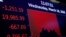 FILE - A board at the New York Stock Exchange shows the state of the market, in New York, March 18, 2020. 