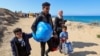 Displaced Palestinians make their way back to their homes in northern Gaza