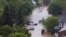  Vehicles surrounded by floodwaters are seen in the neighborhood of Sunnyside in Calgary, Alberta, Canada, June 21, 2013.