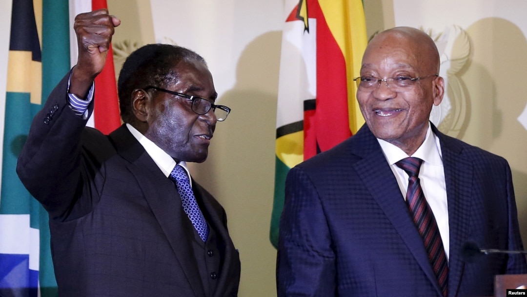 Zimbabwe's President Robert Mugabe (L) and South Africa's President Jacob Zuma have been criticized for failing to address the xenophobic attacks.