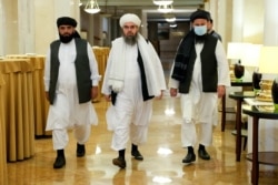 From left, Suhil Shaheen, Mawlawi Shahabuddin Dilawar and Mohammad Naim, members of a political delegation from the Afghan Taliban's movement, arrive for a news conference in Moscow, Russia, July 9, 2021.