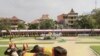 A Cambodian Prince Norodom Chakravuth, third from right, holds plow handles as he takes part in an annual royal plowing ceremony in Phnom Penh, Cambodia, Wednesday, May 9, 2012. The ceremony was held to mark the start of rice-farming season.