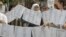 Bosnian Muslim women from Visegrad hold a peaceful protest of the U.N. war crimes tribunal's failure to include counts of rape in indictments against Bosnian Serb cousins Milan and Sredoje Lukic, Sarajevo, July 18, 2008.