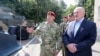 Belarus President Alexander Lukashenko, right, inspects police vehicles as he visits the Belarusian Interior Ministry special forces base in Minsk, Belarus, July 28, 2020.