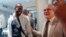 FILE - Sylvain Itte, right, French Ambassador to Niger, greets French journalist Olivier Dubois, at the airport in Niamey, Niger, March 20, 2023. 