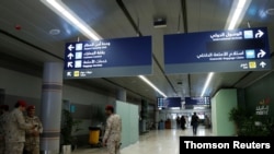 FILE - Saudi security officers are seen at Saudi Arabia's Abha airport after it was attacked by Yemen's Houthi group in Abha, June 13, 2019. 