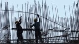 Construction laborers work at under construction residential building in Mumbai, India, Wednesday, May 31, 2023. (AP Photo/Rajanish Kakade)