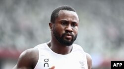 Refugee Olympic Team's Dorian Keletela reacts after winning the men's 100m heats during the Tokyo 2020 Olympic Games at the Olympic Stadium in Tokyo on July 31, 2021.