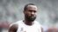 Refugee Olympic Team's Dorian Keletela reacts after winning the men's 100m heats during the Tokyo 2020 Olympic Games at the Olympic Stadium in Tokyo on July 31, 2021.