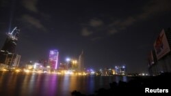 In this file photo taken on April 26, 2015 shows new buildings are seen along the Saigon river in southern Ho Chi Minh City (formerly Saigon City), Vietnam. 